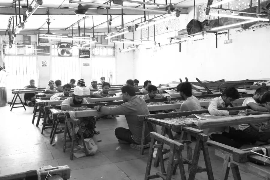 Artisans working on intricate embroidery at Babar Jee Fashion
